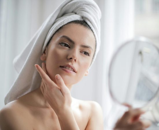 pexels-photo-3764013-3764013 A serene and elegant woman enjoys a skincare ritual, enhancing her natural beauty in the comfort of her home.